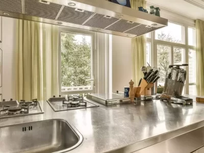 stainless steel countertops. kitchen with windows